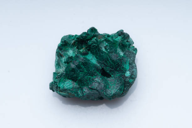 istock Malachite green ore on a white background. Natural green malachite 1289457178