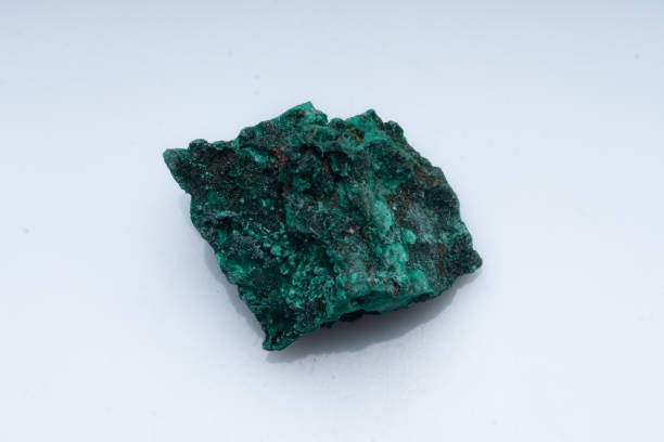 istock Malachite green ore on a white background. Natural green malachite 1289457198