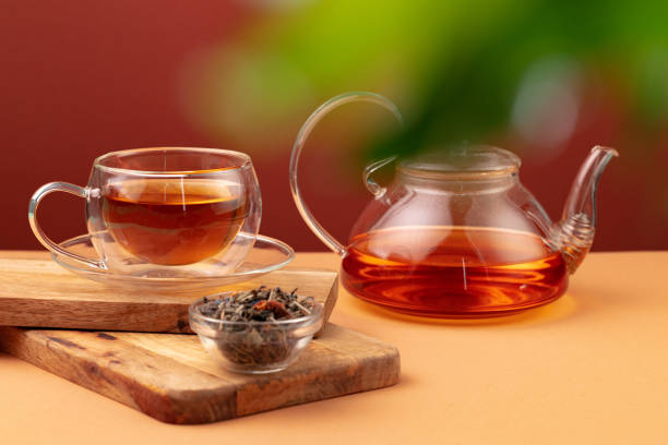 istock Glass teapot and cup with black tea 1289459713