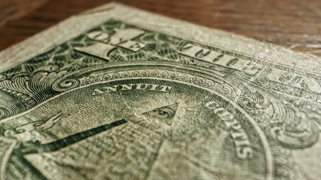 Close-Up Macro Dolly Shot of The Eye of Providence on a 2009 US American One Dollar Bill