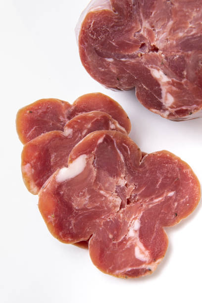 istock Sliced jerky meat on a white plate. Beer snack. Meat for sandwiches 1289465546