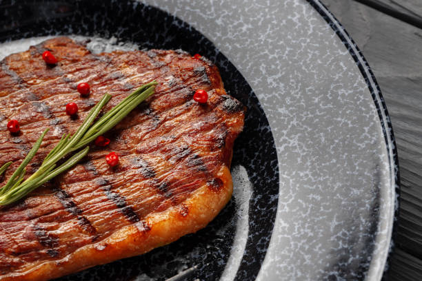 istock Grilled beef steak served on plate close up 1289466303