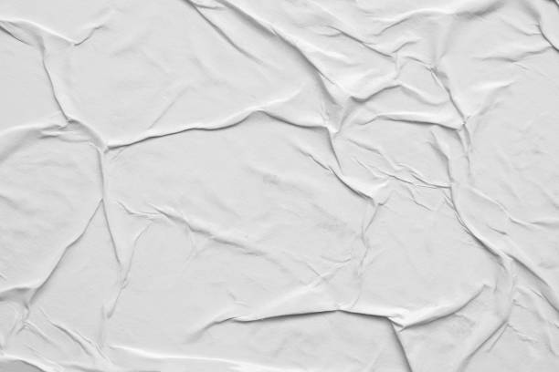 istock Blank white crumpled and creased paper poster texture background 1289467915