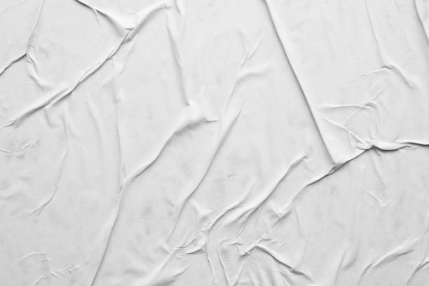 istock Blank white crumpled and creased paper poster texture background 1289467917