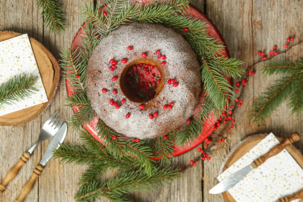 istock Bundt cake decorated with red berries on rustic wooden table. 1289471083