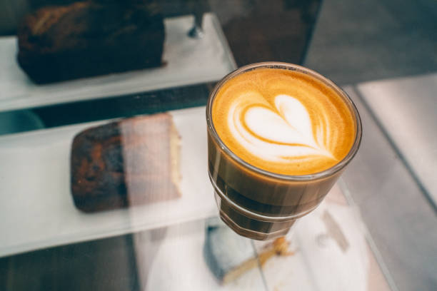 A wonderful cortado prepared by adding milk and milk foam on espresso stock photo
