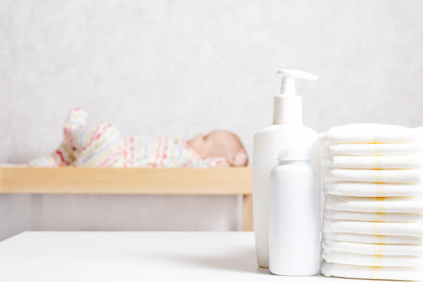 baby care products on table. close up. - baby goods imagens e fotografias de stock