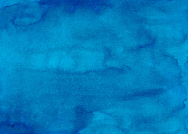 istock Watercolor deep sky blue background texture. Beautiful hand painted aquarelle backdrop. Stains on paper abstract painting. 1289474300