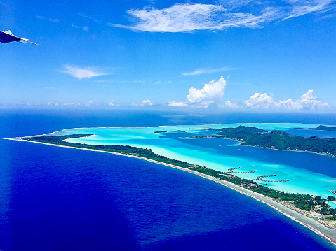 When flying away from Bora Bora island, the Aerial View of the Paradise Bora Bora Island is truly amazing. Here is  Bora Bora Island seen from the air.