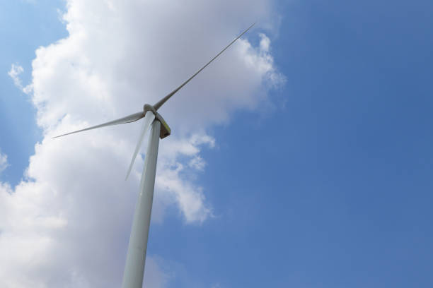 istock Wind turbines generating electricity or for water pump with sky background. 1289478906