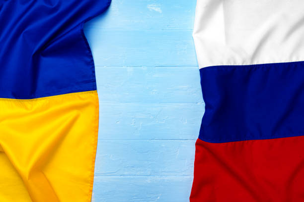 istock Flags of Russia and Ukraine together, copy space 1289481099