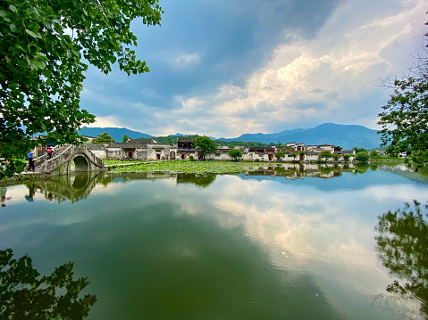 Hongcun, Anhui, China-May 24, 2020: The Unesco World Heritage Site of Hongcun, is the most-visited and best-known of the Huizhou villages. It is a standout example of ancient feng shui planning, a perfect marriage of symbolism and function, predicated on a sophisticated network of waterways.
