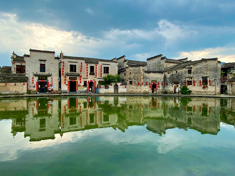 Hongcun, Anhui, China-May 24, 2020: The Unesco World Heritage Site of Hongcun, is the most-visited and best-known of the Huizhou villages. It is a standout example of ancient feng shui planning, a perfect marriage of symbolism and function, predicated on a sophisticated network of waterways.