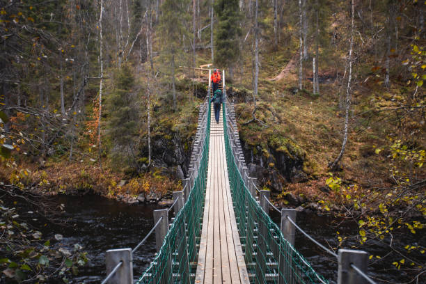 Autumn view of Oulanka National Park, landscape, a finnish national park in the Northern Ostrobothnia and Lapland regions of Finland,  wooden wilderness hut, cabin cottage, bridge, campground place Autumn view of Oulanka National Park, landscape, a finnish national park in the Northern Ostrobothnia and Lapland regions of Finland,  wooden wilderness hut, cabin cottage, bridge, campground finnish lapland autumn stock pictures, royalty-free photos & images