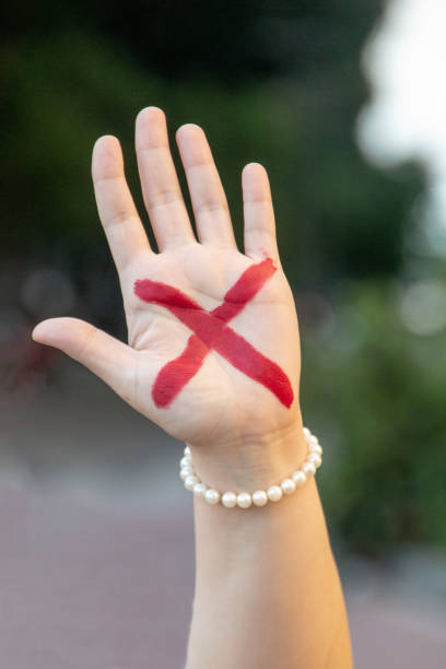 female hand with red x, symbolizing the campaign against domestic violence in Rio de Janeiro stock photo