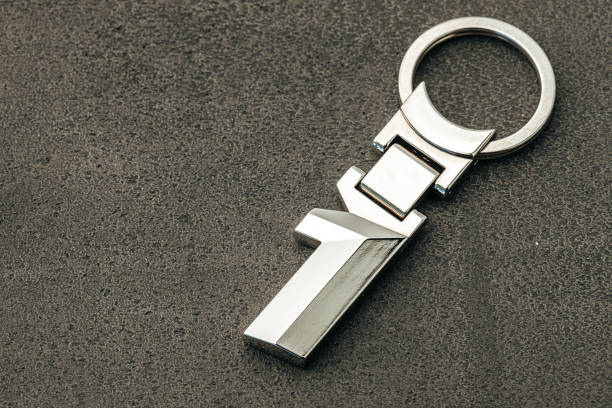 istock Metal number One car key on dark concrete background 1289482906