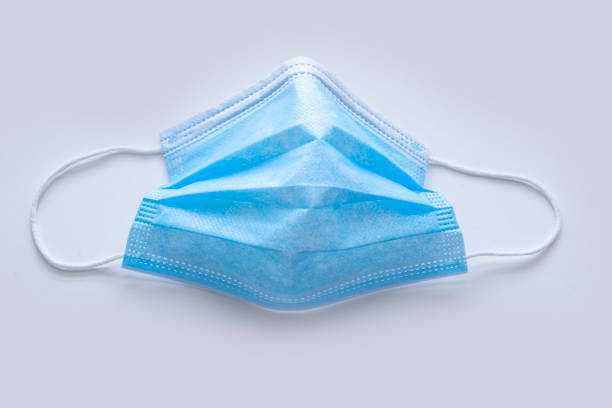 istock A medical face mask on a white background 1289484187