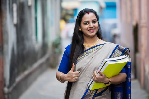 Young Indian Female School Teacher Or College Professor Stock Photo -  Download Image Now - iStock