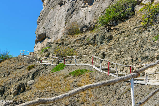 istock Wooden pedestrian ladder on the cliff 1289489628