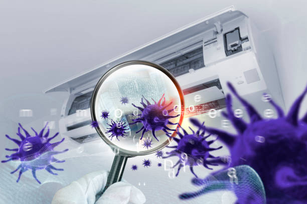 istock 3D simulation of viruses inside the air conditioner filter. 1289492180