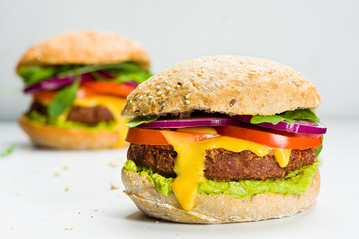 Preparing Vegan burger over white marble background