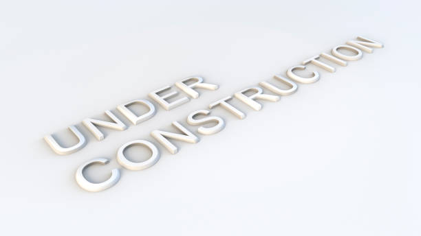 istock 3D render of the words under construction. Sign over white background. Extruded letters. 1289495238