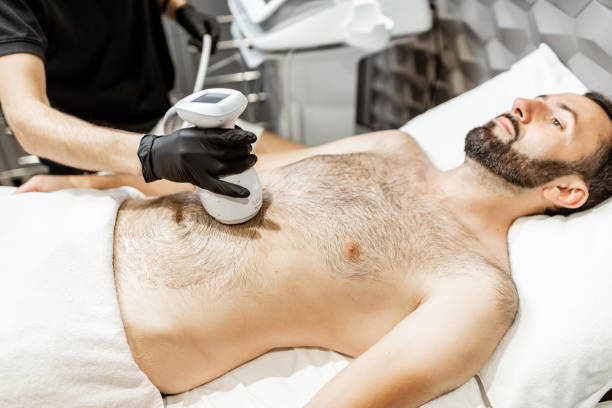 istock Ultrasound liposuction procedure for a male client 1289500007