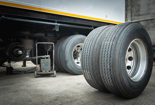 Truck spare wheels tires waiting for to change. trailer wheel maintenance.