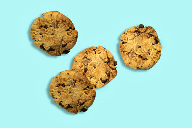 istock Chocolate Chip Cookies isolated on blue background 1289520837
