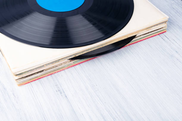 istock an old vinyl record lies on a light gray table, top view 1289521632