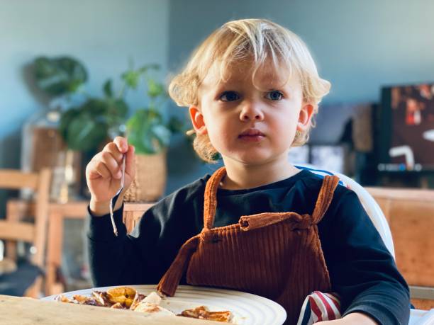 istock Eating toddler boy 1289523473