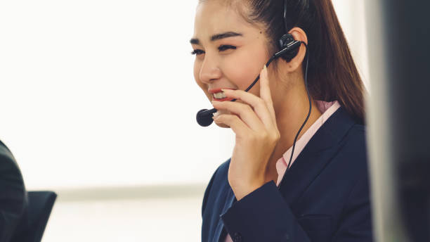 istock Business people wearing headset working in office 1289526395