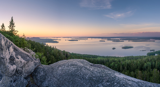 Scenic landscape with lake and sunset at evening in Koli, national park, Finland