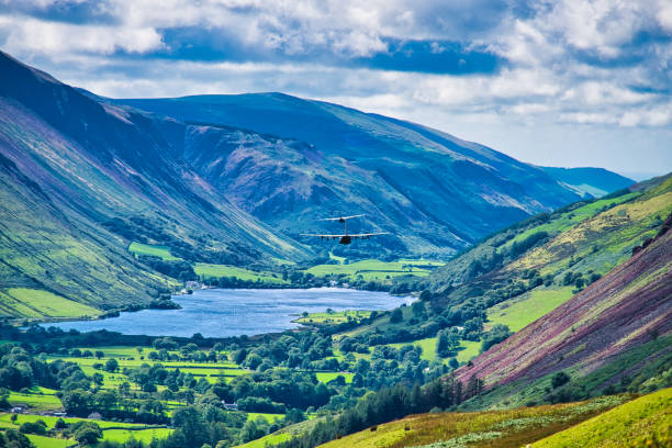 istock Two RAF Lockheed C130 Hercules flying down Welsh valley, Wales, Britain 1289527360