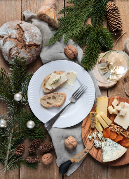 istock rustic Christmas Cheese Board Flatlay with White Wine and bread 1289527436