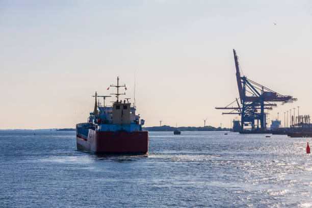 istock Cargo ship on its way to the open sea from a port 1289527749