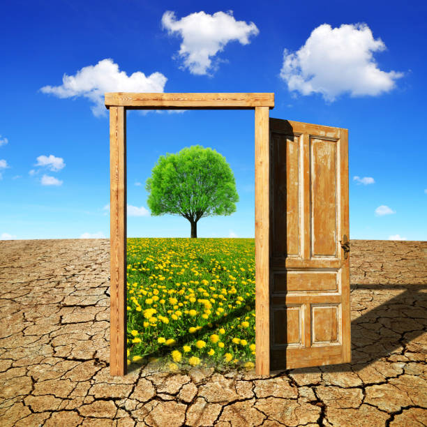 istock Open door to the spring landscape. Climate change concept. 1289527848