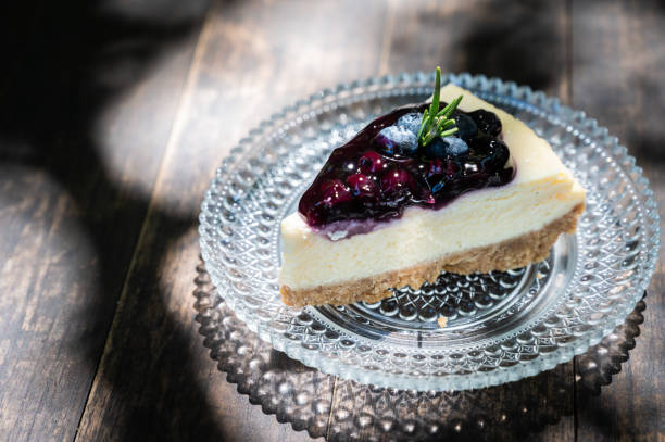 istock A Blueberry cheesecake on wooden table. 1289528501