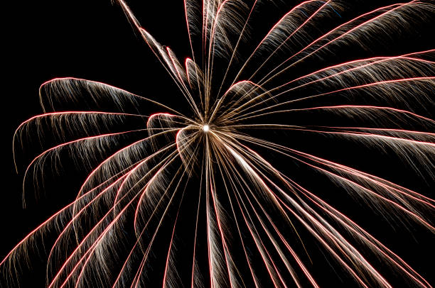 istock Beautiful sparkling holiday fireworks in the night sky 1289528837