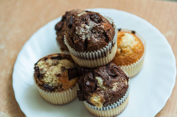 Served Delicious Muffins with Chocolate on the Table.