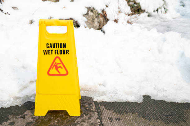 istock close up warning caution sign for wet slip snow floor 1289532645