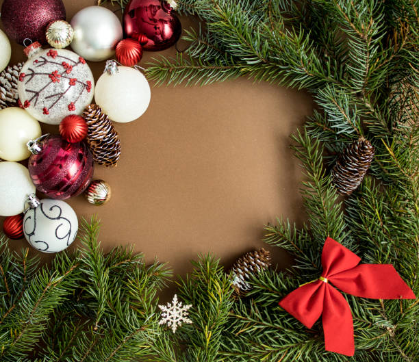 istock Creative composition made of Christmas tree branches with decorative balls, cones and red bow. Flat lay. New Year concept 1289533007