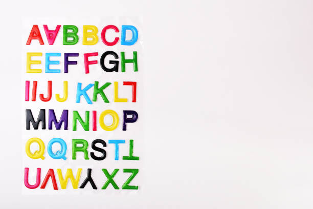 istock Multi colored alphabet letters sticker label on the white background with copy space 1289533887