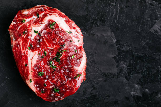 Fresh Raw Rib Eye Steak  prepared for cooking, barbeque, grill.