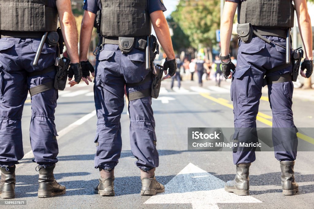 Police officers on duty during street protest Police officers on duty after terrorist attack. Counter terrorism. Police Force Stock Photo
