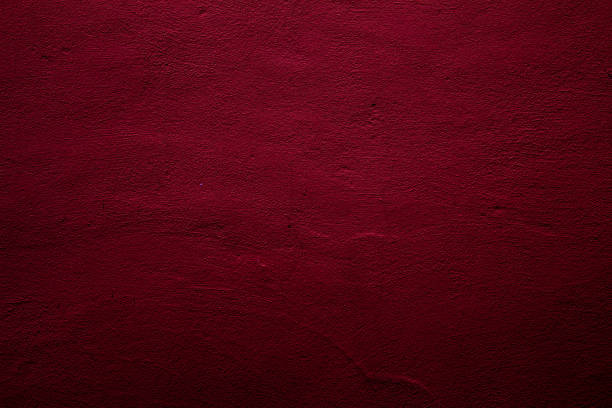 istock Crimson abstract textured wall background in red 1289540319