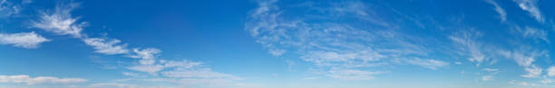 istock Beautiful panoramic view of deep blue sky with puffy white cloud 1289542568
