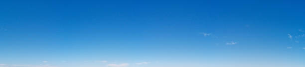 istock Beautiful panoramic view of deep blue sky with puffy white cloud 1289542603