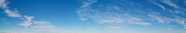 istock Beautiful panoramic view of deep blue sky with puffy white cloud 1289542622