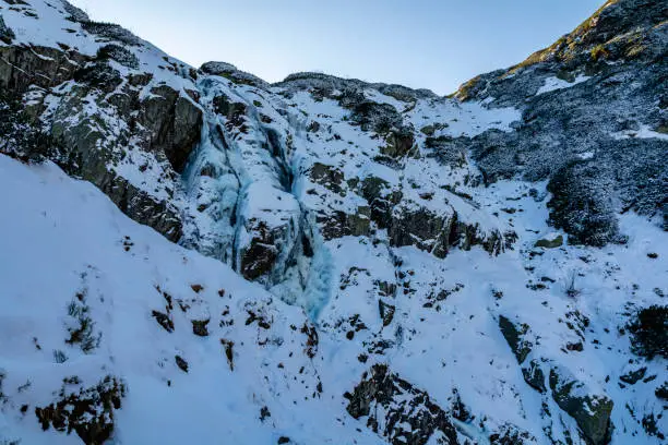 Photo of Siklawa (Wielka Siklawa) - The largest waterfall in Poland in winter scenery. Tatra Mountains.